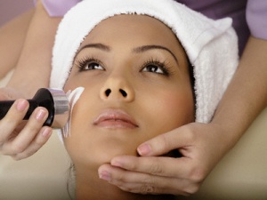 Woman having microdermabrasion